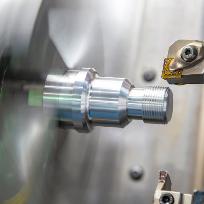 CNC lathe manufacturing a precision machined component